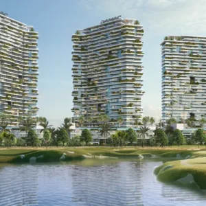 High-rise residential towers with rooftop greenery and lagoon waterfront