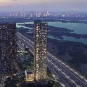 Aerial sunset view of high-rise residential towers near water
