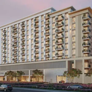 Mid-rise residential apartment with balconies and sunset view